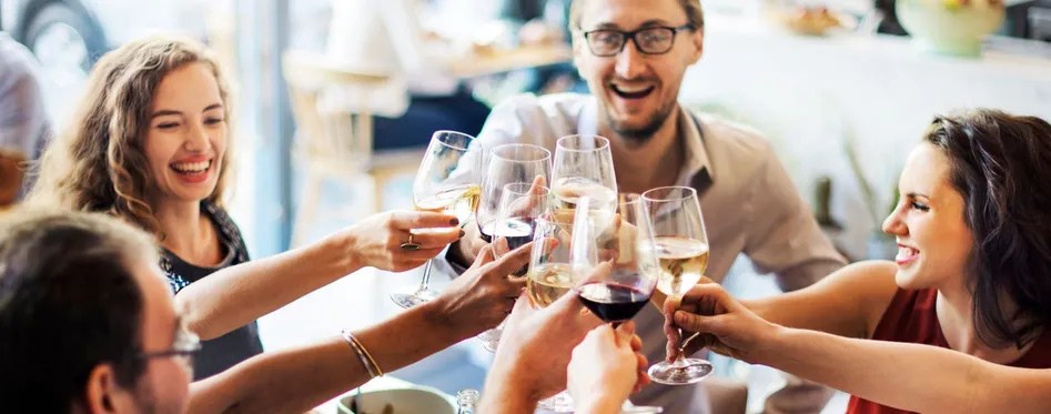 a woman drinking a glass of wine