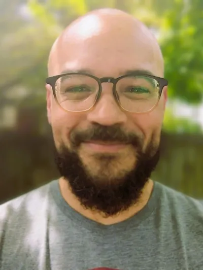 Drew photo a man wearing glasses